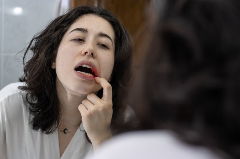 Patient checking their gums for gum disease